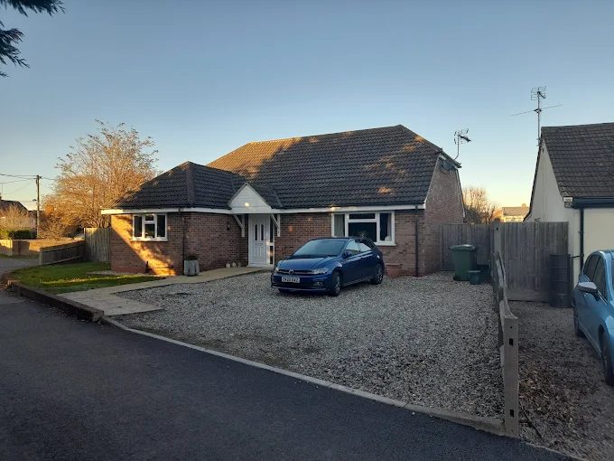 Brick bungalow with gravel driveway