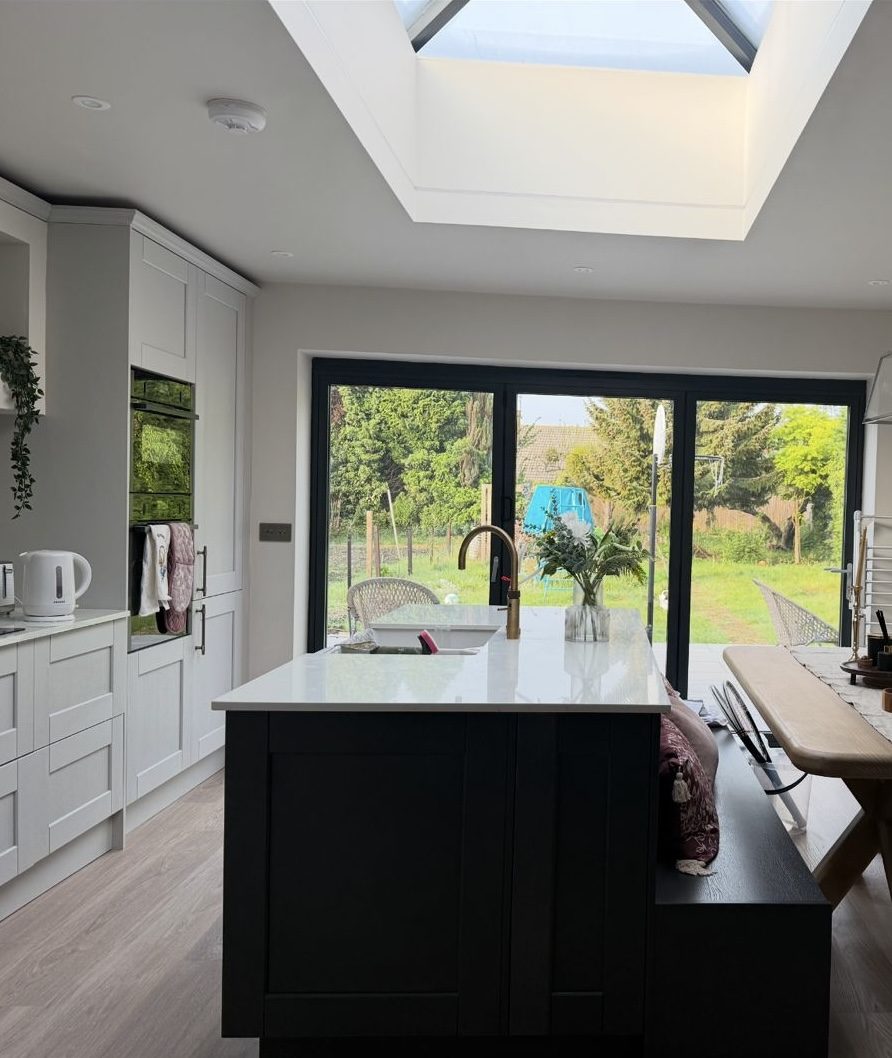 Kitchen extension with island and bifold doors onto the garden